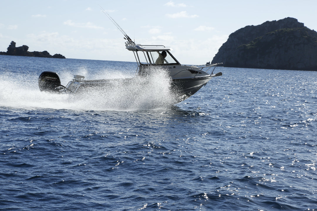 McLay 651 Sportsman alloy boat on trailer, featuring hard top and Yamaha outboard at Warren Hay Marine. Whangarei