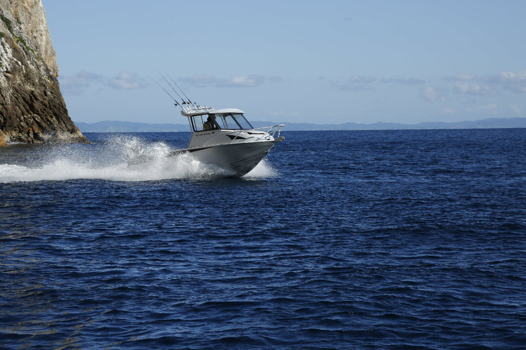 McLay 651 Sportsman alloy boat on trailer, featuring hard top and Yamaha outboard at Warren Hay Marine. Whangarei