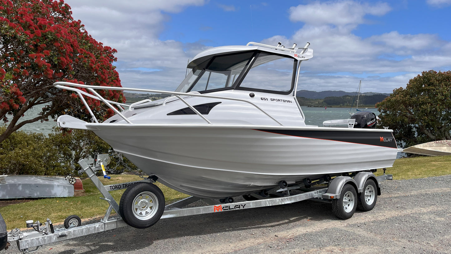 McLay 651 Sportsman alloy boat on trailer, featuring hard top and Mercury outboard at Warren Hay Marine. Whangarei