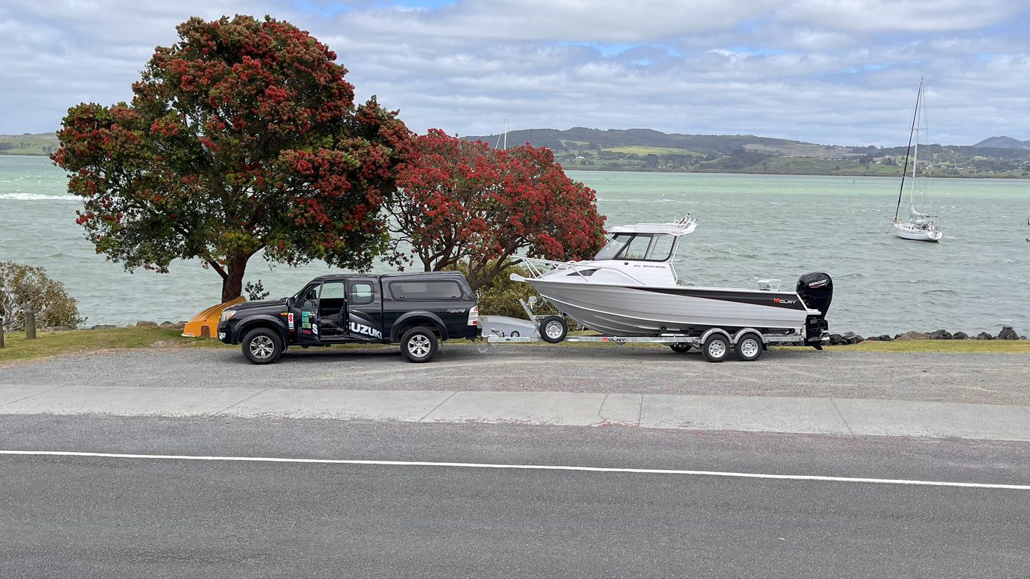 McLay 651 Sportsman alloy boat on trailer, featuring hard top and Mercury outboard at Warren Hay Marine. Whangarei