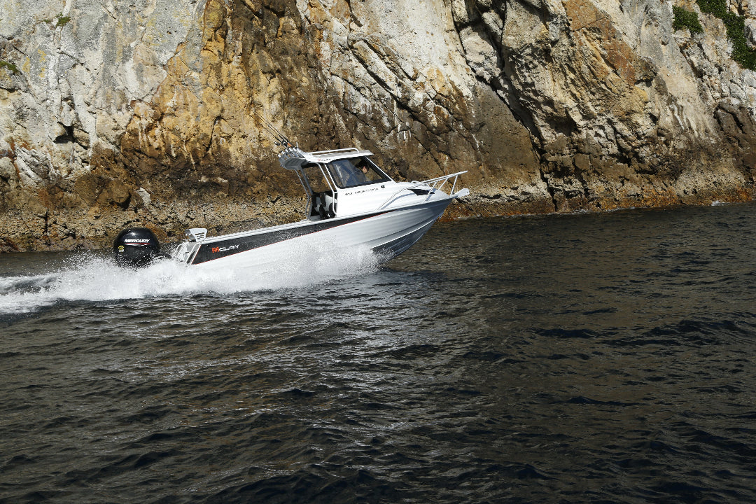 McLay 651 Sportsman alloy boat on trailer, featuring hard top and Yamaha outboard at Warren Hay Marine. Whangarei