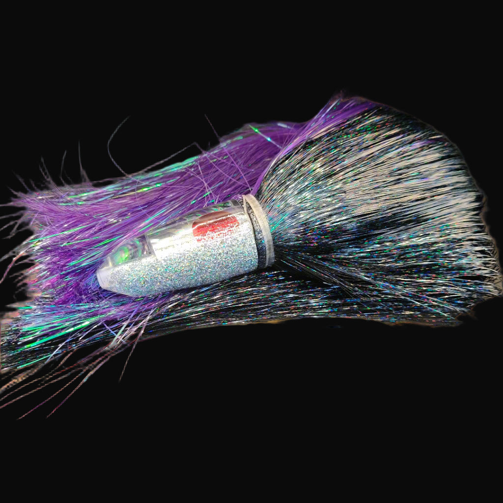 Tantrum Medium Bullet lure with silver/clear head and purple/black Strobez skirts – available at Warren Hay Marine.