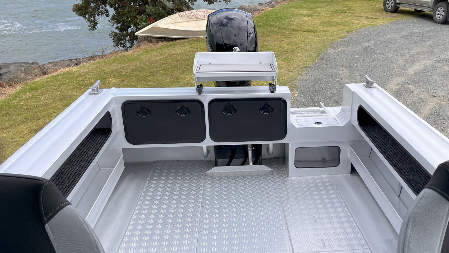 McLay 651 Sportsman alloy boat on trailer, featuring hard top and Mercury outboard at Warren Hay Marine. Whangarei