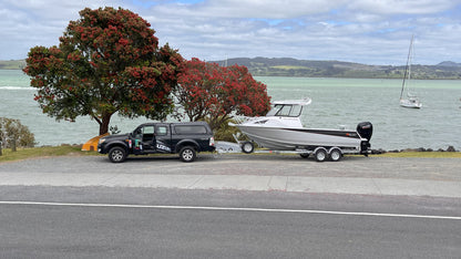 McLay 651 Sportsman alloy boat on trailer, featuring hard top and Mercury outboard at Warren Hay Marine. Whangarei