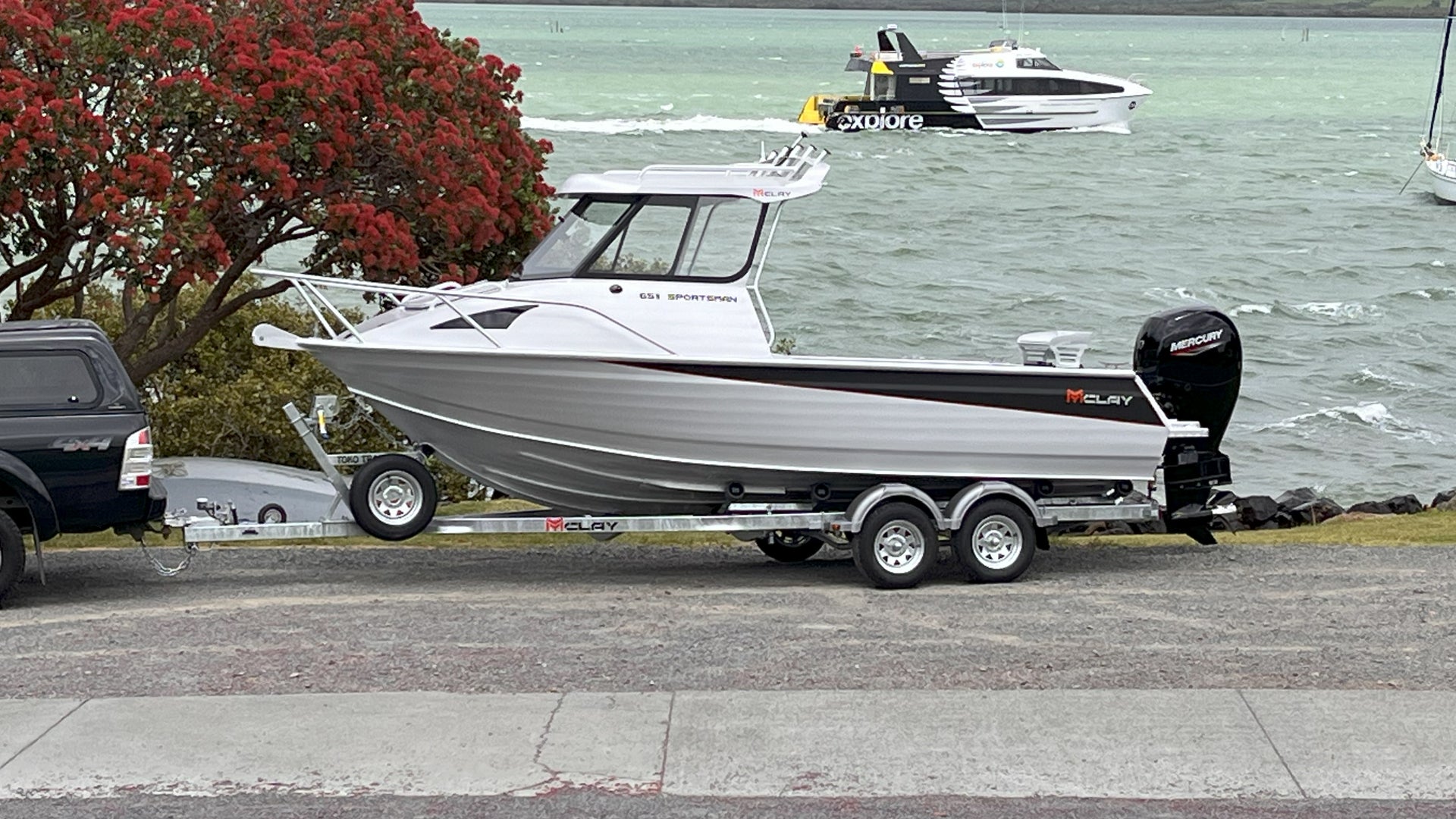 McLay 651 Sportsman alloy boat on trailer, featuring hard top and Yamaha outboard at Warren Hay Marine. Whangarei