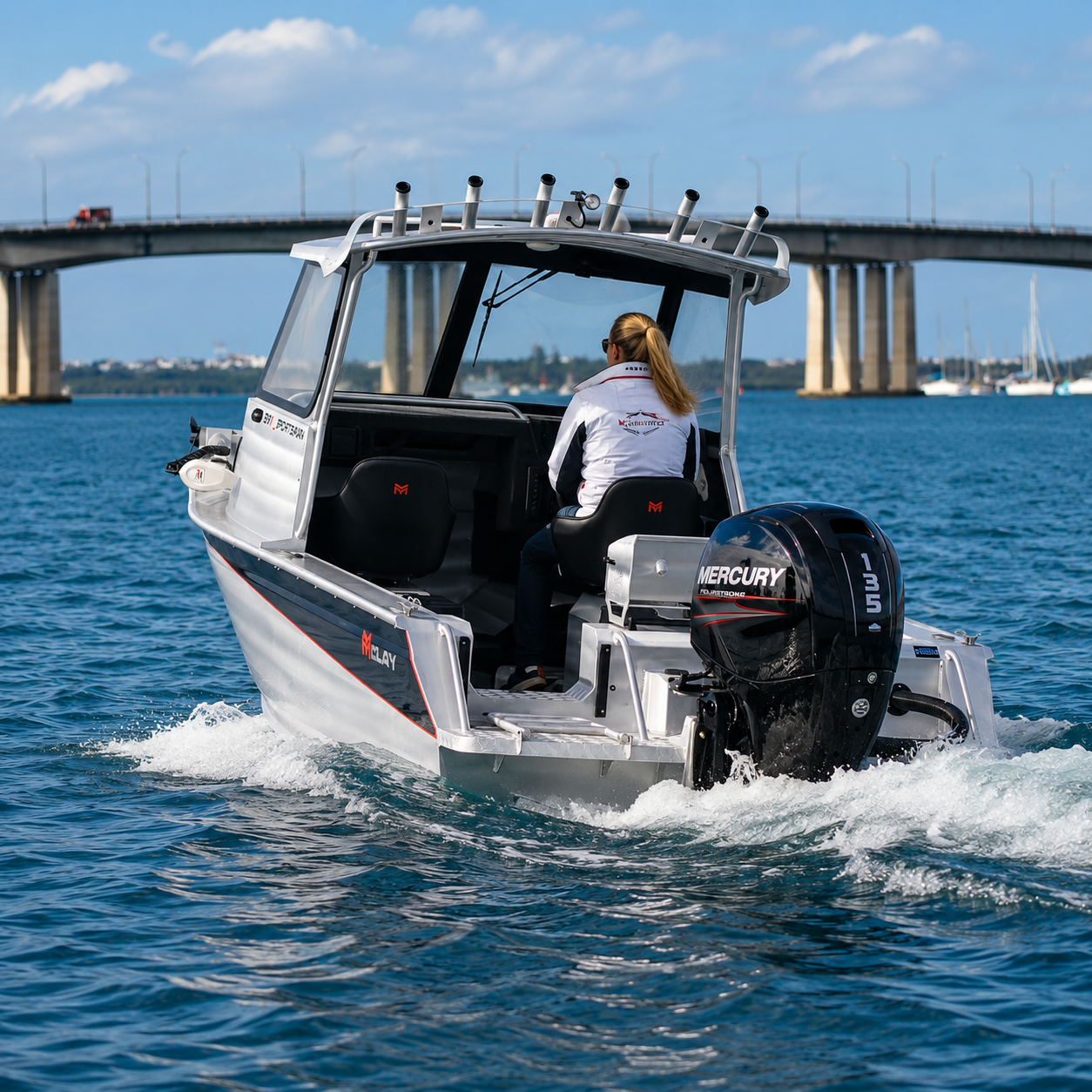 McLay Sportsman 591 HT on trailer powered by a Mercury outboard and ready for offshore fishing adventures.