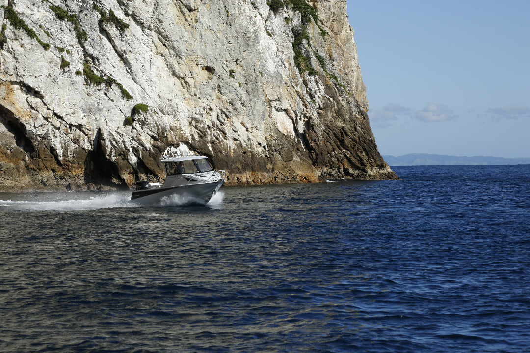 McLay 651 Sportsman alloy boat on trailer, featuring hard top and Yamaha outboard at Warren Hay Marine. Whangarei