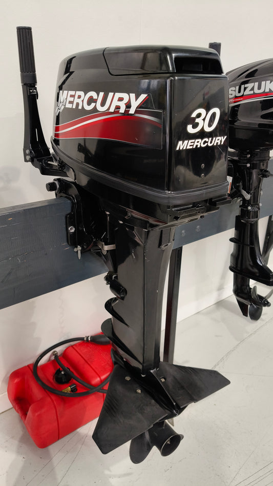 Used Mercury ME30HP 2-stroke tiller steer outboard motor with 20-inch shaft in great condition