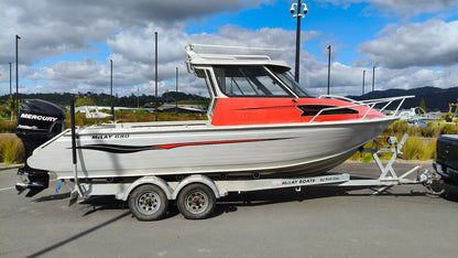 Used 2010 McLay 680 hardtop boat powered by a 225hp Mercury Optimax outboard, sitting on a tandem-axle Toko trailer. Features include boarding ladder, bait board, trim tabs, step mounts, livebait tank, twin batteries with VSR and isolation switch, GME VHF, Lowrance HDS 8, and 170L underfloor fuel tank. Warren Hay Marine, Whangarei