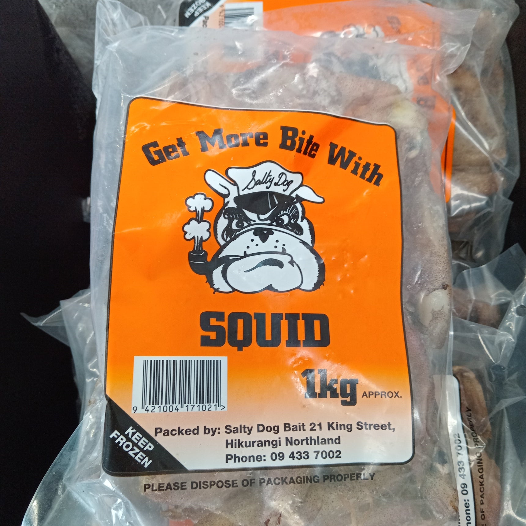Packaged 1kg Salty Dog Squid Block with branding and product information displayed on the label.