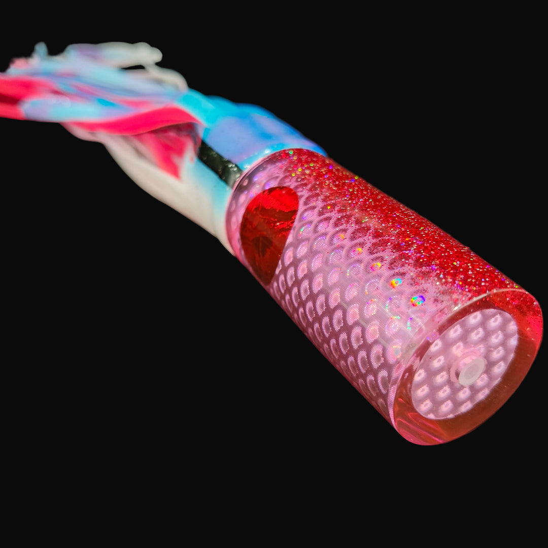 Tantrum Medium AMN game lure with pink head and Blue Ocean skirts in blue white over pink Tough Tails.