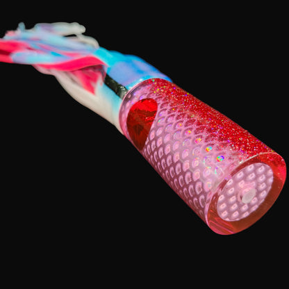 Tantrum Medium AMN game lure with pink head and Blue Ocean skirts in blue white over pink Tough Tails.