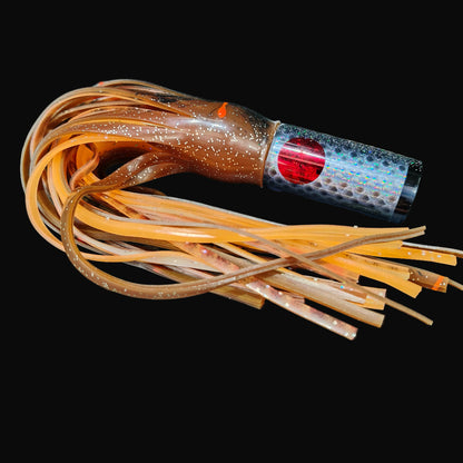 Tantrum Small AMN game lure with black head and Blue Ocean skirts in dark brown over orange brown.