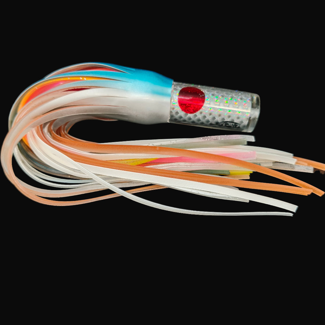 Tantrum Small AMN game lure with clear head and Blue Ocean skirts in blue/silver over orange/pink.