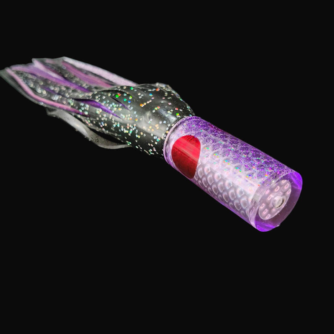 Tantrum Small AMN game lure with purple head and Blue Ocean skirts in black over purple.