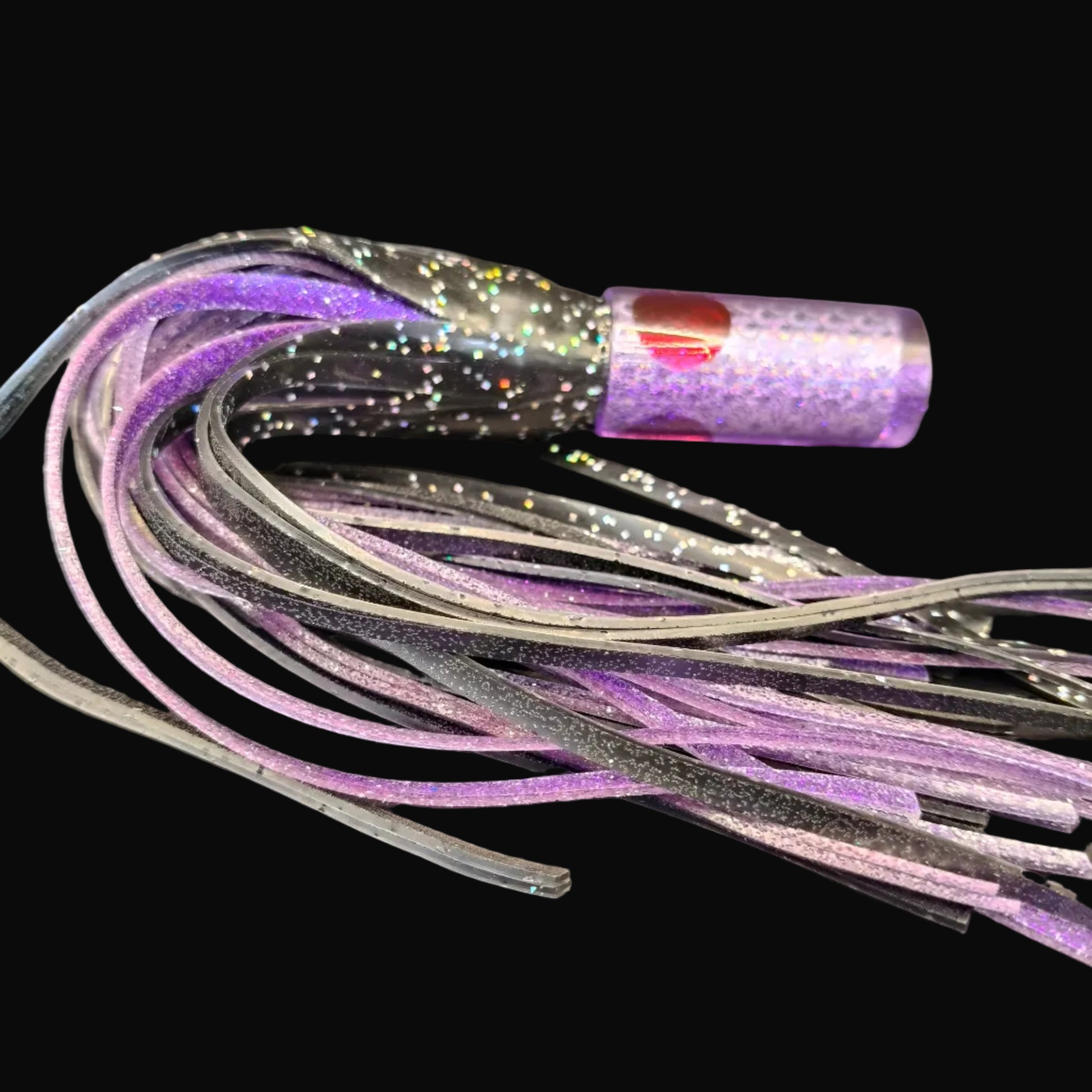 Tantrum Small AMN lure with purple head and BlueOcean black over purple skirts, 270mm.