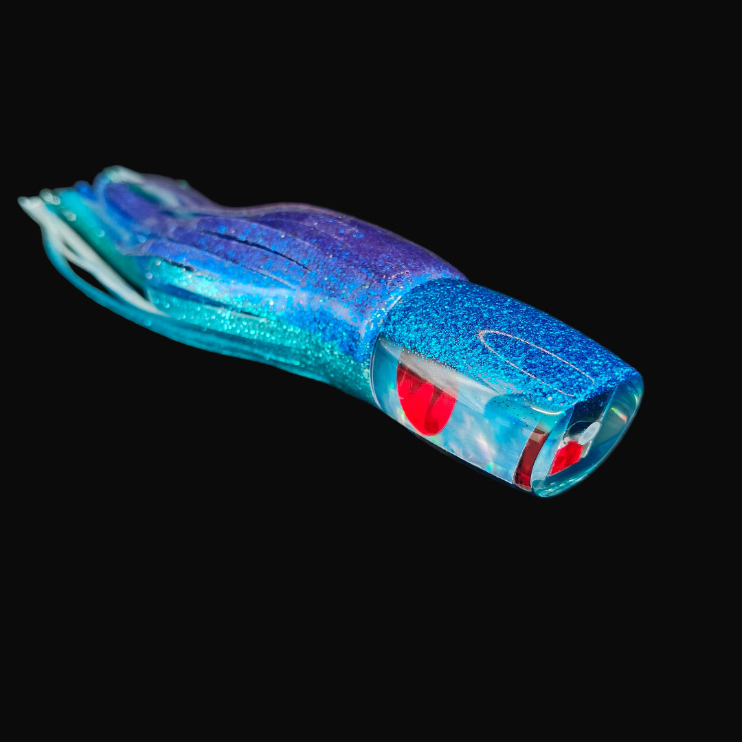 Tantrum Small Bandit LB Pelagic trolling lure with blue/mint head and blue/green ocean skirts.