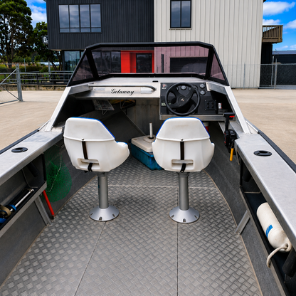 Used Boats, Interior view of the used Ramco Getaway aluminium runabout showing the helm, twin pedestal seats, open cockpit, side storage, and forward cuddy cabin access. Warren Hay Marine, Whangarei