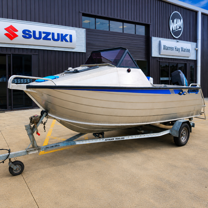 Used Boats, Front port-side view of a used Ramco Getaway aluminium runabout with Mercury four-stroke outboard on a Voyager trailer, parked outside Warren Hay Marine, Whangārei.