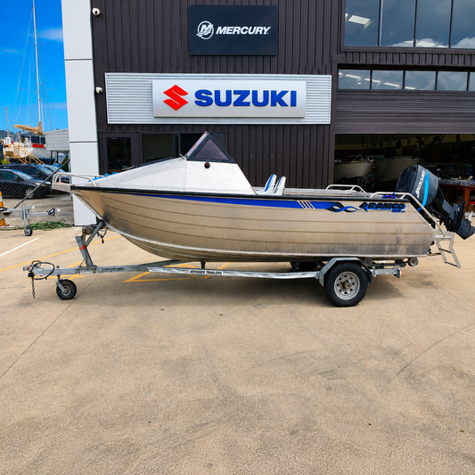 Used Boats, Port side view of a used Ramco Getaway aluminium runabout with Mercury two-stroke outboard on a Voyager trailer, parked outside Warren Hay Marine, Whangārei.