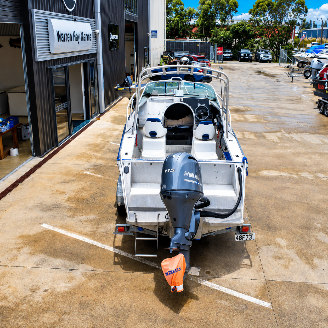 Rear fishing platform and transom of the Ramco Fishmaster 580 with Yamaha F115 FourStroke and boarding access.