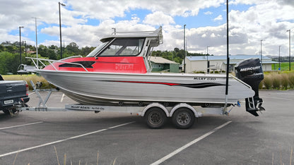 Used 2010 McLay 680 hardtop boat powered by a 225hp Mercury Optimax outboard, sitting on a tandem-axle Toko trailer. Features include boarding ladder, bait board, trim tabs, step mounts, livebait tank, twin batteries with VSR and isolation switch, GME VHF, Lowrance HDS 8, and 170L underfloor fuel tank. Warren Hay Marine, Whangarei