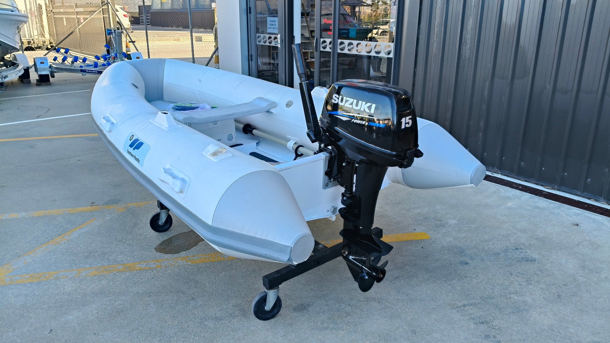 South pacifc tender and suzuki DT15 2 stroke outboard 