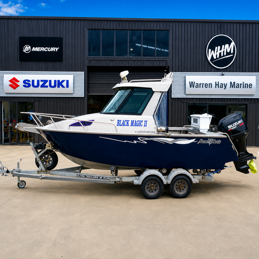 Used boats, Port side view of a 2018 Marco 600 Sou'Wester Hard Top with Suzuki BF140 four-stroke outboard on an Ultra Trailers tandem axle trailer at Warren Hay Marine, Whangārei.