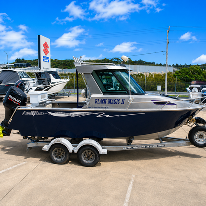 Used Boats, Starboard side view of a 2018 Marco 600 Sou'Wester Hard Top with Suzuki BF140 four-stroke outboard on an Ultra Trailers tandem axle trailer at Warren Hay Marine, Whangārei.